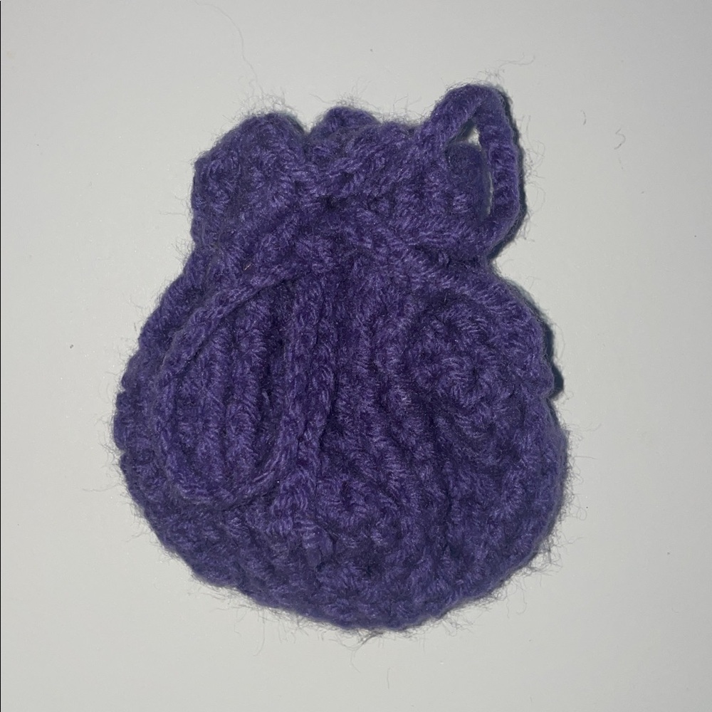 Miniature lavender-colored pouch